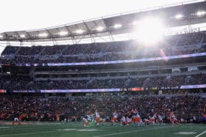CINCINNATI, OHIO - JANUARY 04: Shedeur Sanders #12 of the Cleveland Browns hands off to teammate Dylan Sampson #22 during the fourth quarter of the game against the Cincinnati Bengals at Paycor Stadium on January 04, 2026 in Cincinnati, Ohio.