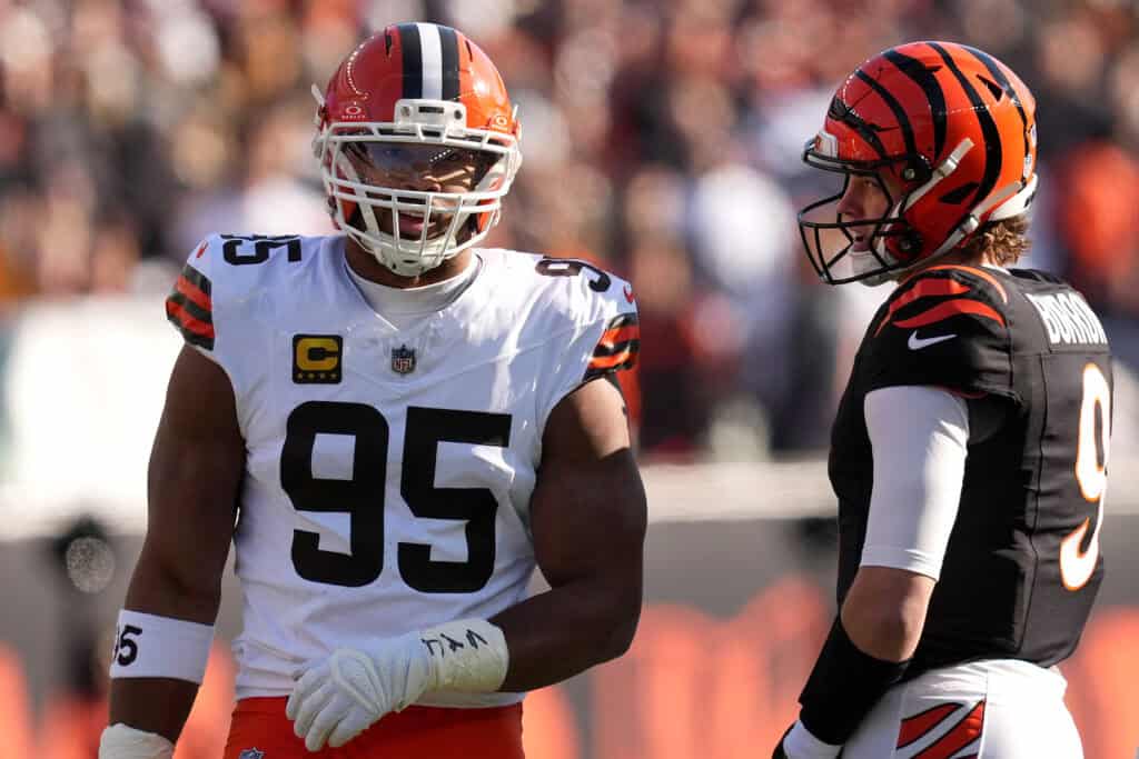 CINCINNATI, OHIO - JANUARY 04: Myles Garrett #95 of the Cleveland Browns and Joe Burrow #9 of the Cincinnati Bengals chat during the first quarter of the game at Paycor Stadium on January 04, 2026 in Cincinnati, Ohio.