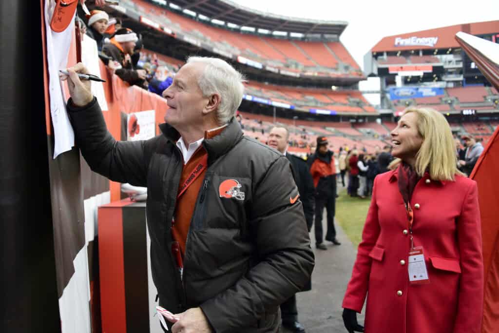 LEVELAND, OH - DECEMBER 24: Owner Jimmy Haslam signs autographs before the game with his wife Dee Haslam at FirstEnergy Stadium on December 24, 2016 in Cleveland, Ohio.