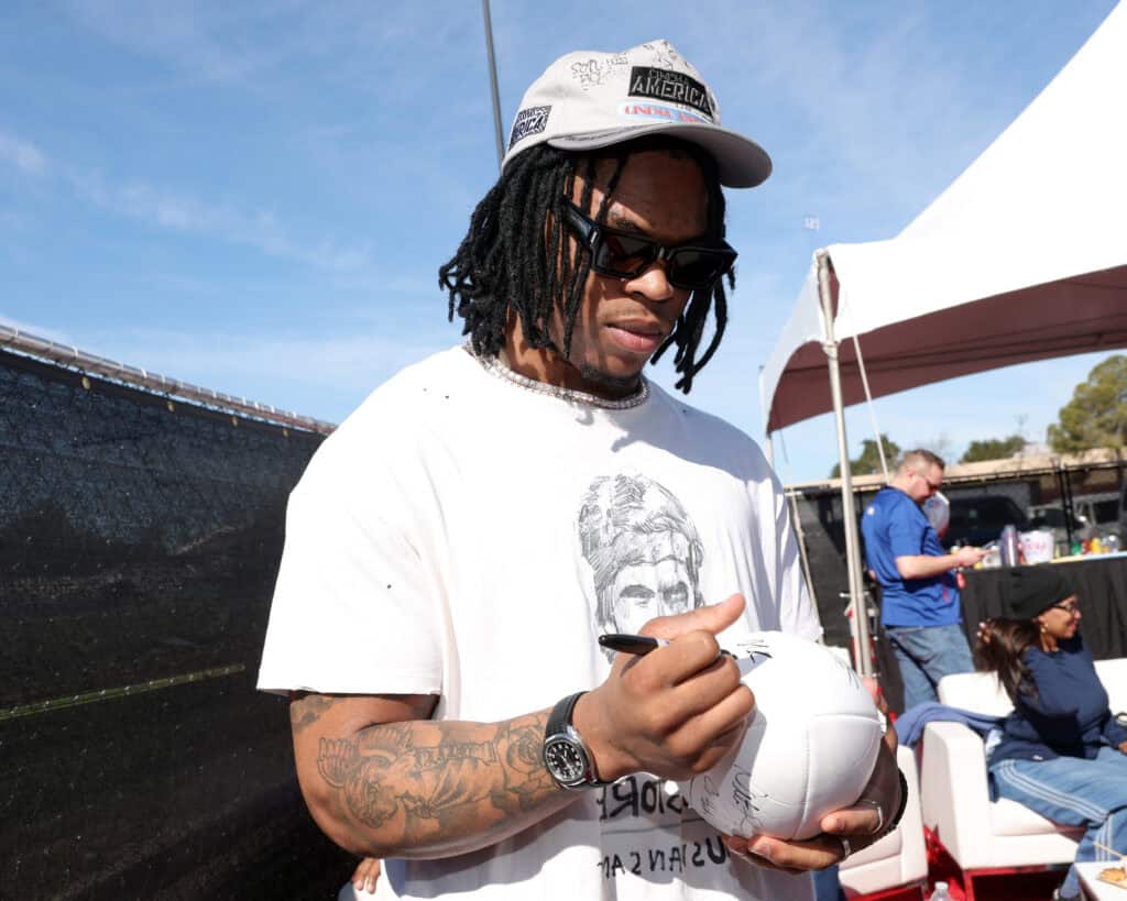 SANTA CLARA, CALIFORNIA - FEBRUARY 08: Quinshon Judkins signs autographs during the 2026 Players Tailgate Santa Clara on February 08, 2026 in Santa Clara, California.