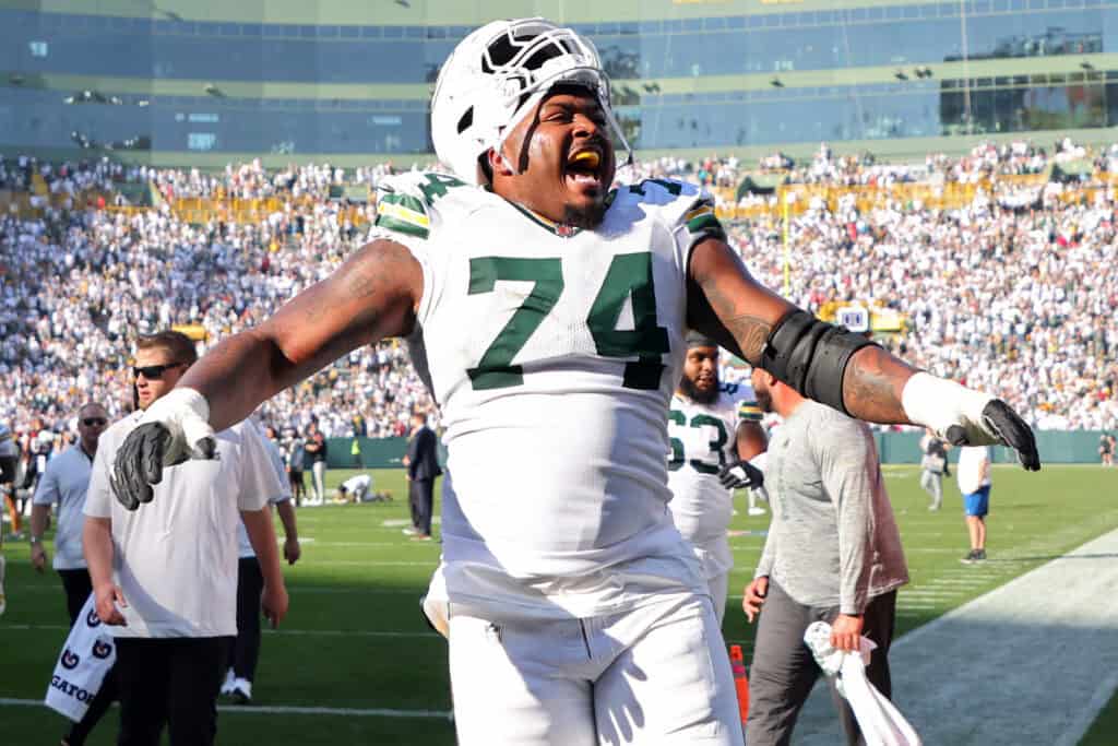 GREEN BAY, WISCONSIN - OCTOBER 20: Elgton Jenkins #74 of the Green Bay Packers celebrates after beating the Houston Texans 24-22 at Lambeau Field on October 20, 2024 in Green Bay, Wisconsin.