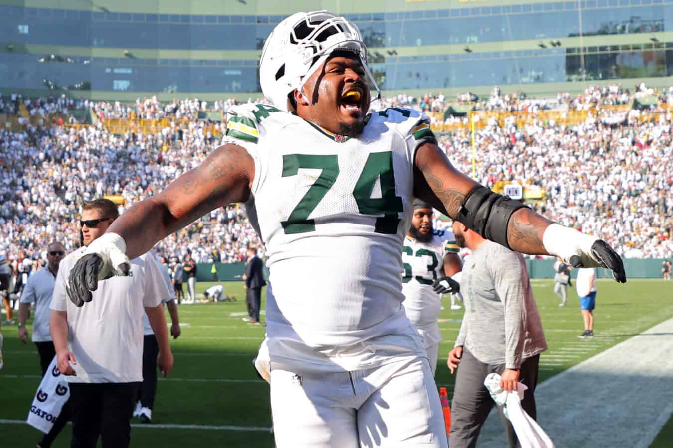 GREEN BAY, WISCONSIN - OCTOBER 20: Elgton Jenkins #74 of the Green Bay Packers celebrates after beating the Houston Texans 24-22 at Lambeau Field on October 20, 2024 in Green Bay, Wisconsin.