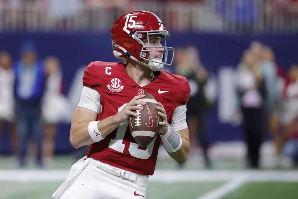 ATLANTA, GEORGIA - DECEMBER 06: Ty Simpson #15 of the Alabama Crimson Tide looks to throw the ball against the Georgia Bulldogs during the fourth quarter in the 2025 SEC Championship at Mercedes-Benz Stadium on December 06, 2025 in Atlanta, Georgia.