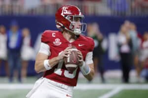 ATLANTA, GEORGIA - DECEMBER 06: Ty Simpson #15 of the Alabama Crimson Tide looks to throw the ball against the Georgia Bulldogs during the fourth quarter in the 2025 SEC Championship at Mercedes-Benz Stadium on December 06, 2025 in Atlanta, Georgia.