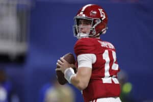 ATLANTA, GEORGIA - DECEMBER 06: Ty Simpson #15 of the Alabama Crimson Tide looks to throw the ball against the Georgia Bulldogs during the first quarter in the 2025 SEC Championship at Mercedes-Benz Stadium on December 06, 2025 in Atlanta, Georgia.