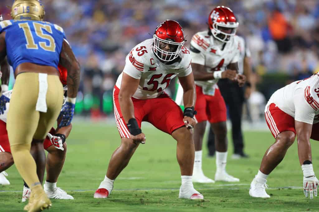 PASADENA, CALIFORNIA - AUGUST 30: Spencer Fano #55 of the Utah Utes llines up on the defensive line during the second half of a game against the UCLA Bruins at Rose Bowl Stadium on August 30, 2025 in Pasadena, California.