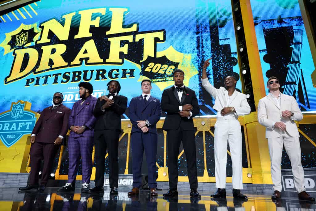 PITTSBURGH, PENNSYLVANIA - APRIL 23: (L-R) Kayden McDonald of Ohio State, Kadyn Proctor of Alabama, Arvell Reese of Ohio State, Ty Simpson of Alabama, Sonny Styles of Ohio State, Carnell Tate of Ohio State and Dillon Thieneman of Oregon pose on stage prior to Round One of the 2026 NFL Draft at Acrisure Stadium on April 23, 2026 in Pittsburgh, Pennsylvania.