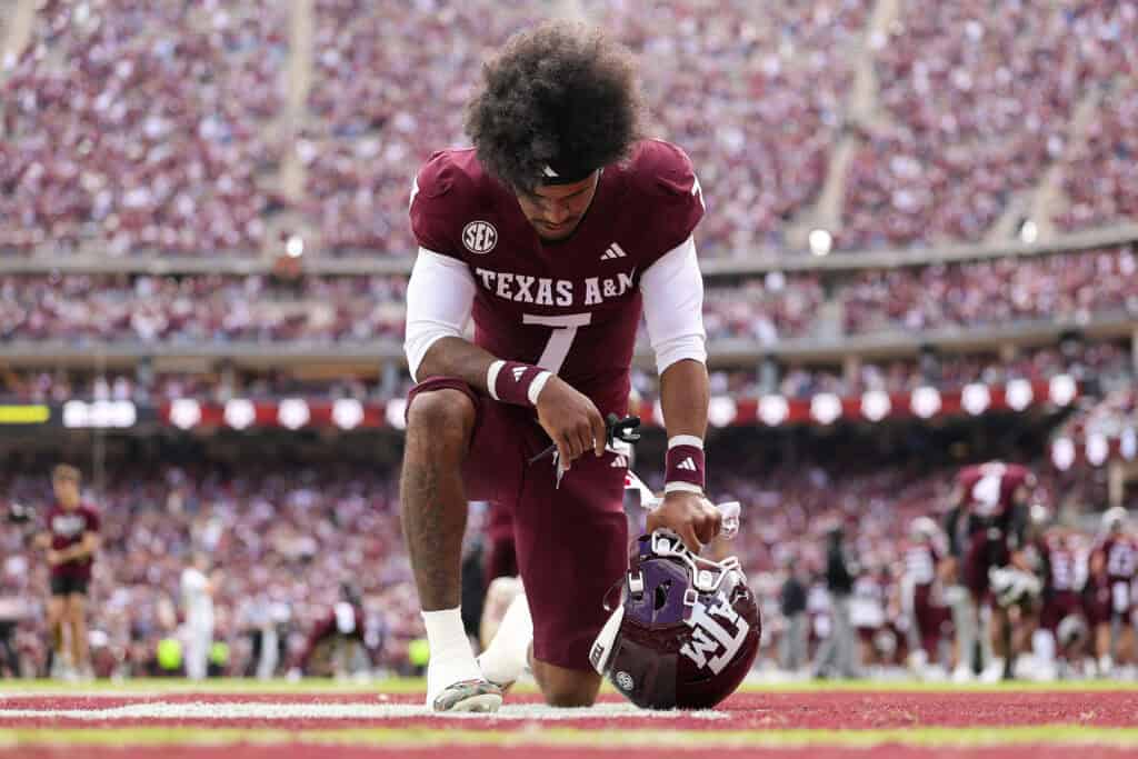 COLLEGE STATION, TEXAS - NOVEMBER 15: KC Concepcion #7 of the Texas A&M Aggies takes a knee in the end zone before playing the South Carolina Gamecocks during the first quarter at Kyle Field on November 15, 2025 in College Station, Texas.