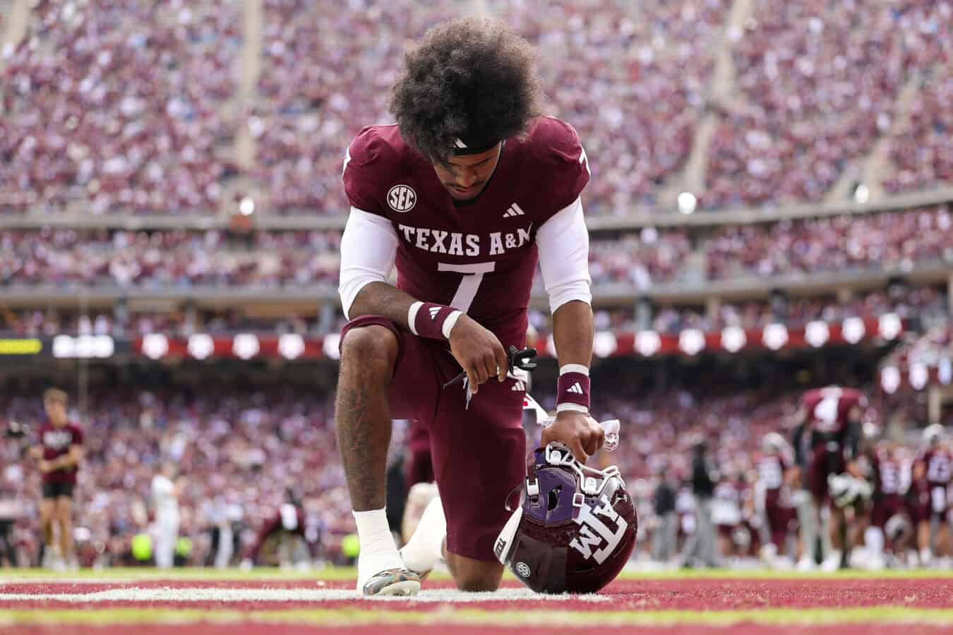 COLLEGE STATION, TEXAS - NOVEMBER 15: KC Concepcion #7 of the Texas A&M Aggies takes a knee in the end zone before playing the South Carolina Gamecocks during the first quarter at Kyle Field on November 15, 2025 in College Station, Texas.