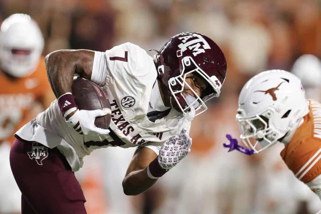 AUSTIN, TEXAS - NOVEMBER 28: KC Concepcion #7 of the Texas A&M Aggies runs with the ball against the Texas Longhorns during the first quarter at Darrell K Royal-Texas Memorial Stadium on November 28, 2025 in Austin, Texas.