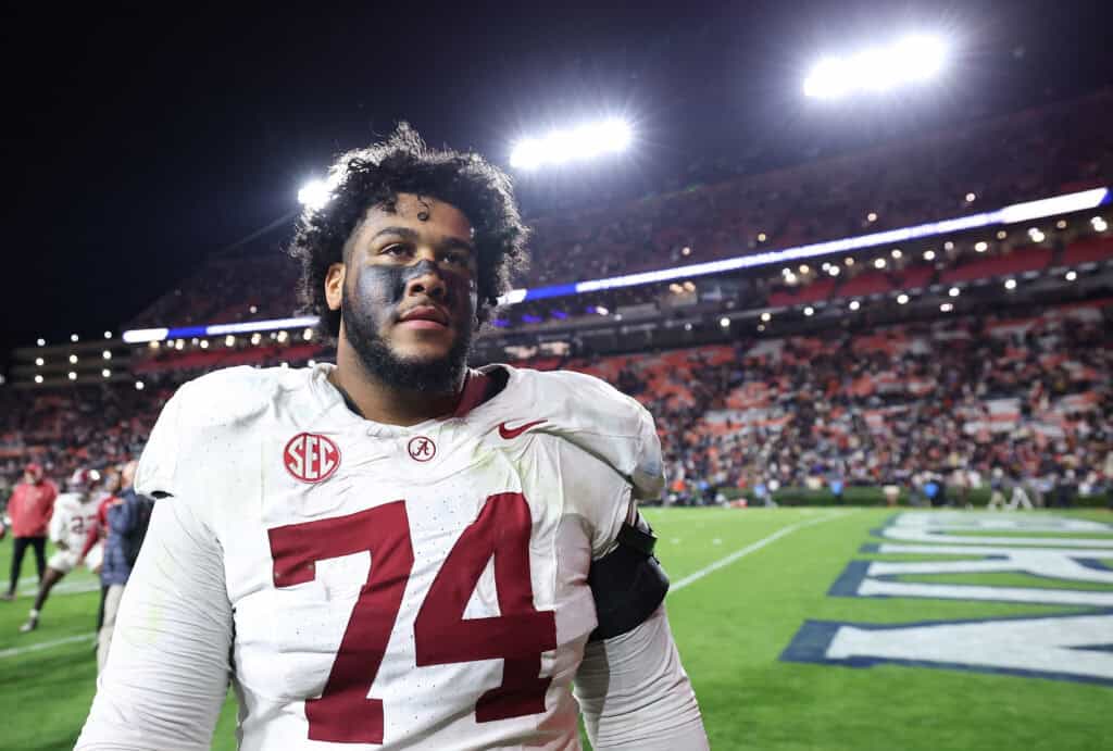 AUBURN, ALABAMA - NOVEMBER 29: Kadyn Proctor #74 of the Alabama Crimson Tide reacts after their 27-20 win over the Auburn Tigers at Jordan-Hare Stadium on November 29, 2025 in Auburn, Alabama.