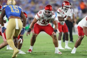 PASADENA, CALIFORNIA - AUGUST 30: Spencer Fano #55 of the Utah Utes llines up on the defensive line during the second half of a game against the UCLA Bruins at Rose Bowl Stadium on August 30, 2025 in Pasadena, California.