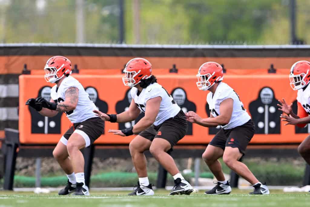 BEREA, OHIO - MAY 08: Austin Barber #58, Spencer Fano #55 and Parker Brailsford #52 of the Cleveland Browns run a drill during a rookie minicamp at CrossCountry Mortgage Campus on May 08, 2026 in Berea, Ohio.