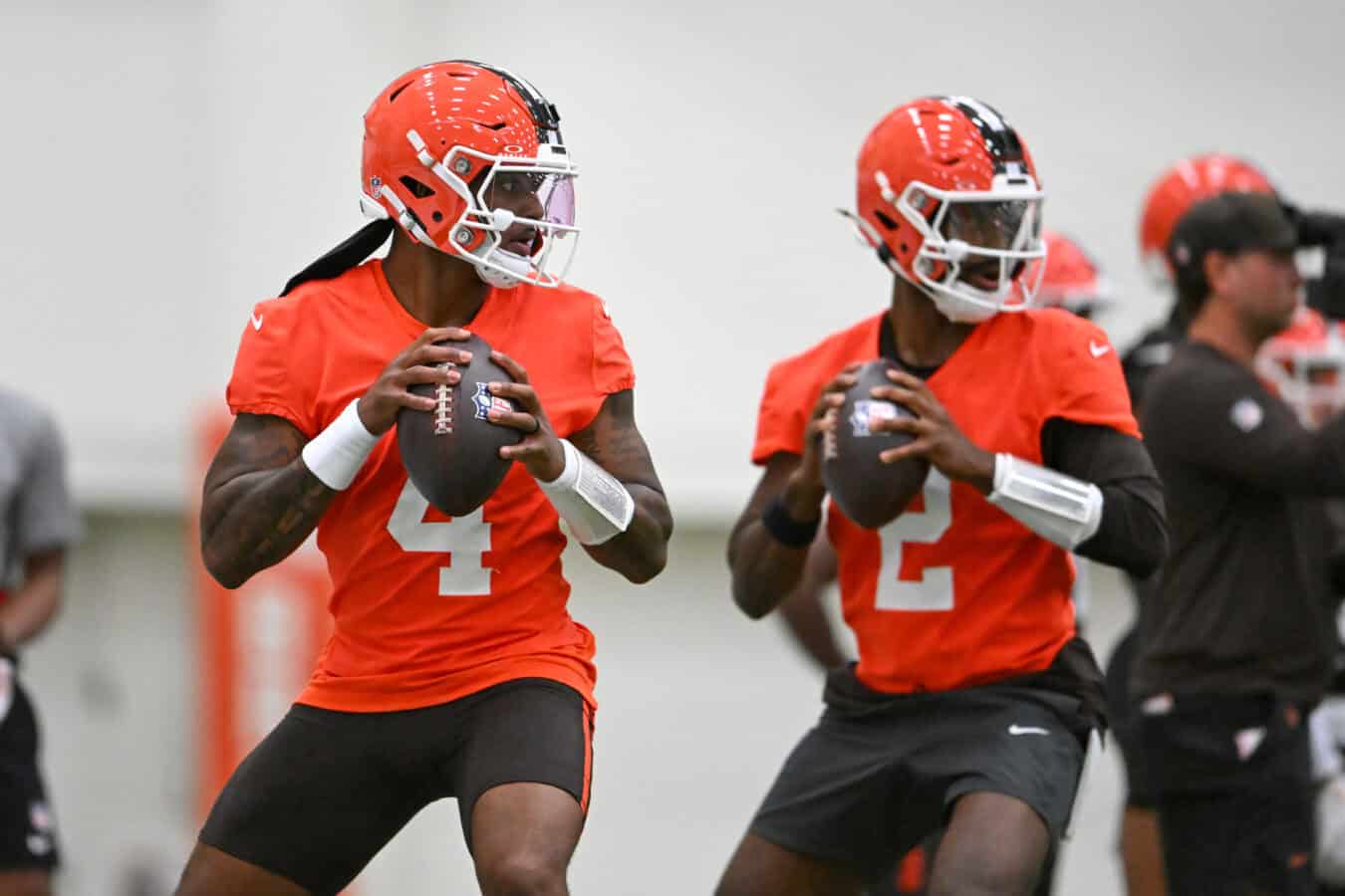 BEREA, OHIO - MAY 20: Deshaun Watson #4 and Shedeur Sanders #2 of the Cleveland Browns look to pass during the Cleveland Browns OTA Offseason Workouts at CrossCountry Mortgage Campus on May 20, 2026 in Berea, Ohio.