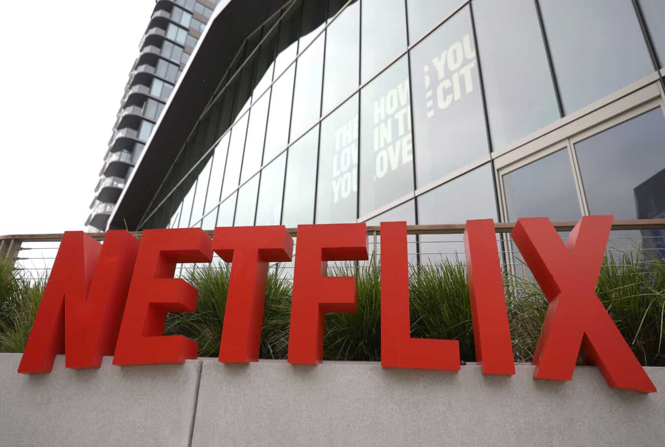LOS ANGELES, CALIFORNIA - MAY 12: The Netflix logo is displayed at a company office on May 12, 2026 in Los Angeles, California. Texas Attorney General Ken Paxton filed a lawsuit on Monday accusing Netflix of illegally collecting and monetizing user data, including from children, while using features like autoplay to encourage addictive viewing habits. Netflix has denied the claims.