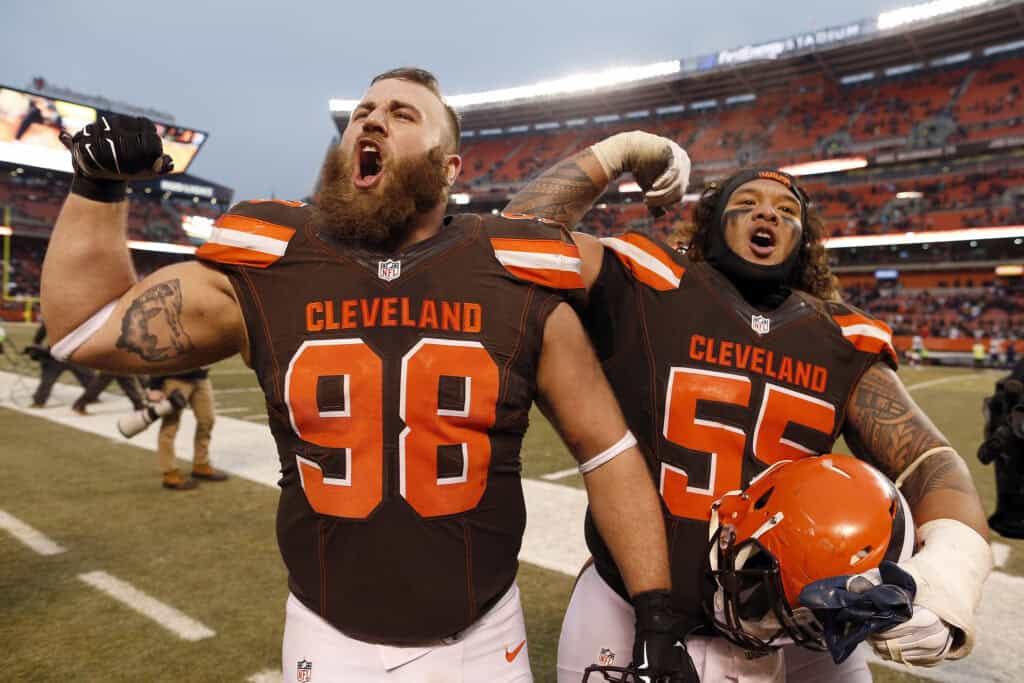 CLEVELAND, OH - DECEMBER 24: Jamie Meder #98 and Danny Shelton #55 of the Cleveland Browns celebrate after defeating the San Diego Chargers 20-17 at FirstEnergy Stadium on December 24, 2016 in Cleveland, Ohio.