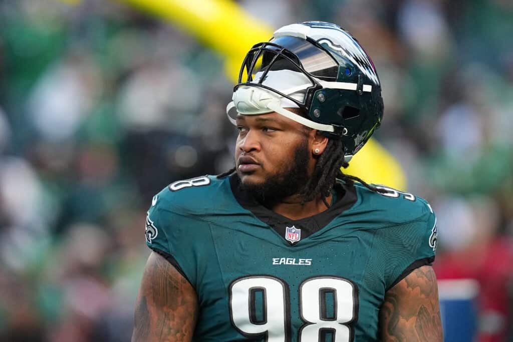 PHILADELPHIA, PENNSYLVANIA - JANUARY 11: Jalen Carter #98 of the Philadelphia Eagles looks on before the NFC Wild Card Playoff game against the San Francisco 49ers at Lincoln Financial Field on January 11, 2026 in Philadelphia, Pennsylvania.