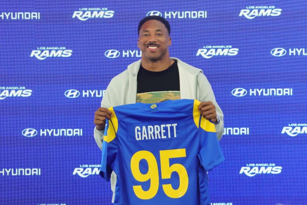WOODLAND HILLS, CALIFORNIA - JUNE 2: Myles Garrett #95 of the Los Angeles Rams poses with his jersey during a press conference after an organized team activities workout at Rams Village at the Warner Center on June 2, 2026 in Woodland Hills, California.