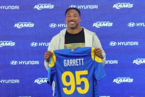 WOODLAND HILLS, CALIFORNIA - JUNE 2: Myles Garrett #95 of the Los Angeles Rams poses with his jersey during a press conference after an organized team activities workout at Rams Village at the Warner Center on June 2, 2026 in Woodland Hills, California.