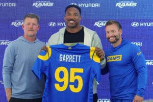 WOODLAND HILLS, CALIFORNIA - JUNE 2: Myles Garrett #95 of the Los Angeles Rams poses with general manager Les Snead and head coach Sean McVay during a press conference after an organized team activities workout at Rams Village at the Warner Center on June 2, 2026 in Woodland Hills, California.