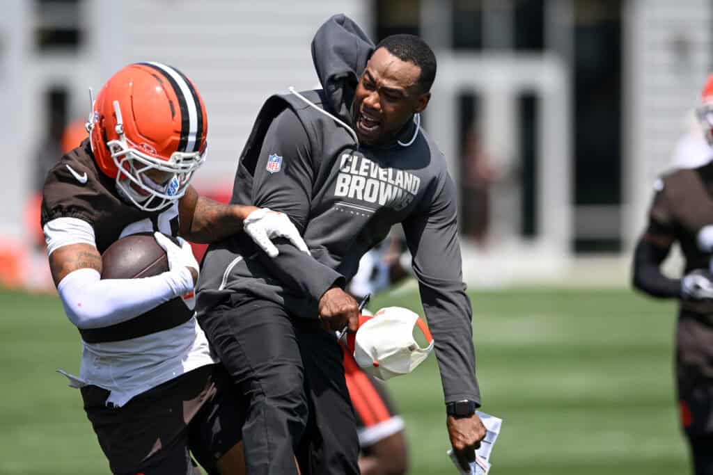 BEREA, OHIO - JULY 29: Defensive backs coach/pass game specialist Brandon Lynch of the Cleveland Browns (R) celebrates an interception by Michael Coats Jr. #39 during Cleveland Browns Training Camp at CrossCountry Mortgage Campus on July 29, 2026 in Berea, Ohio.
