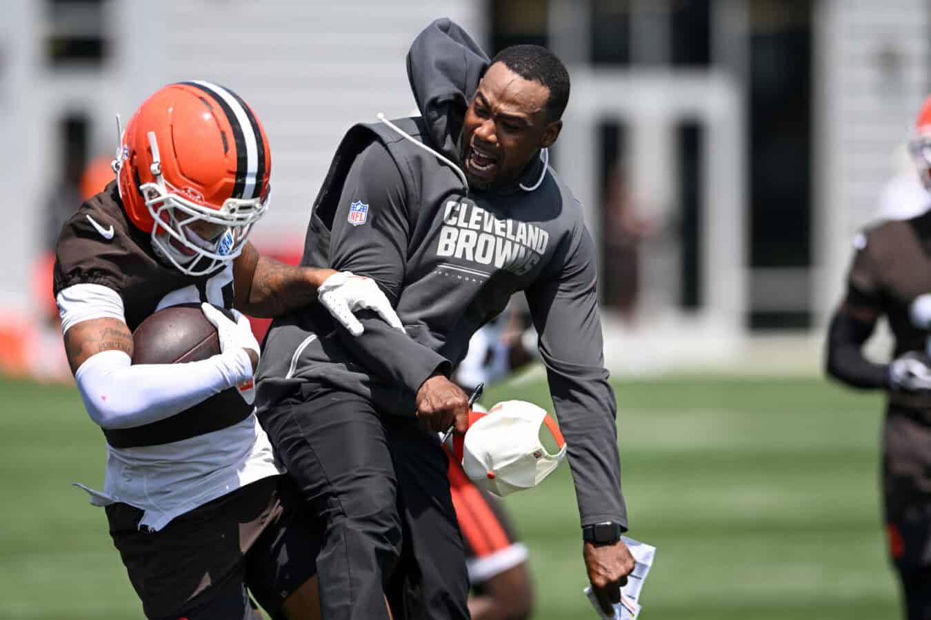 BEREA, OHIO - JULY 29: Defensive backs coach/pass game specialist Brandon Lynch of the Cleveland Browns (R) celebrates an interception by Michael Coats Jr. #39 during Cleveland Browns Training Camp at CrossCountry Mortgage Campus on July 29, 2026 in Berea, Ohio.