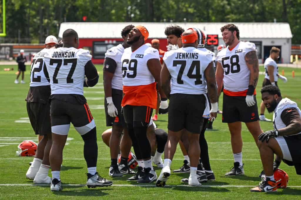 BEREA, OHIO - JULY 29: Tyre Phillips #69 of the Cleveland Browns sings with the offensive line as they warm up during Cleveland Browns Training Camp at CrossCountry Mortgage Campus on July 29, 2026 in Berea, Ohio.