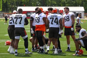 BEREA, OHIO - JULY 29: Tyre Phillips #69 of the Cleveland Browns sings with the offensive line as they warm up during Cleveland Browns Training Camp at CrossCountry Mortgage Campus on July 29, 2026 in Berea, Ohio.