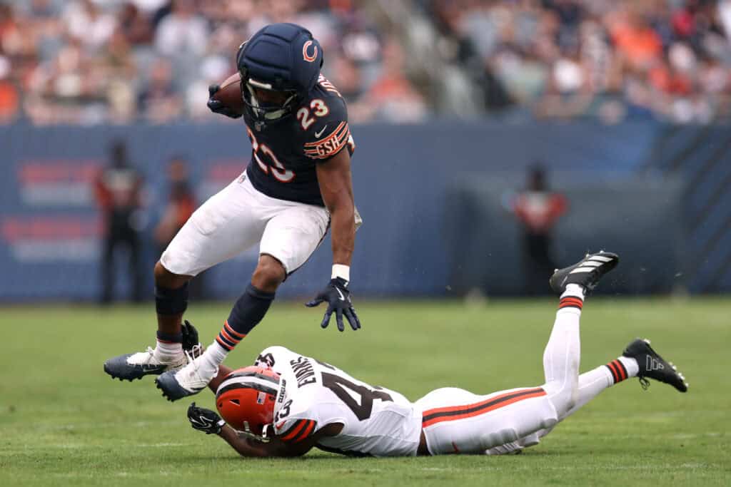 CHICAGO, ILLINOIS - AUGUST 15: Roschon Johnson #23 of the Chicago Bears breaks a tackle from Nate Evans #43 of the Cleveland Browns during the second quarter of a preseason game at Soldier Field on August 15, 2026 in Chicago, Illinois.