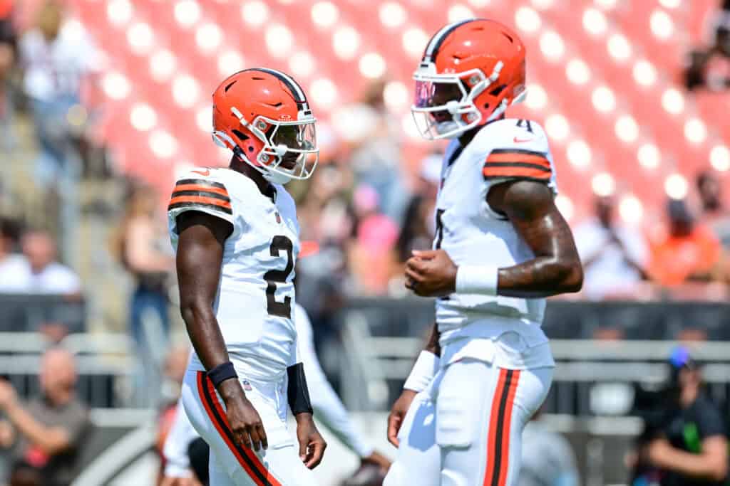 CLEVELAND, OHIO - AUGUST 22: Shedeur Sanders #2 and Deshaun Watson #4 of the Cleveland Browns warm up prior to a preseason game against the Buffalo Bills at Huntington Bank Field on August 22, 2026 in Cleveland, Ohio.