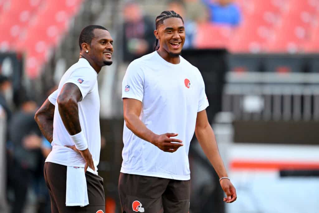 CLEVELAND, OHIO - AUGUST 27: Quarterback Deshaun Watson #4 jokes with quarterback Taylen Green #15 of the Cleveland Browns before a preseason game against the New England Patriots at Huntington Bank Field on August 27, 2026 in Cleveland, Ohio.