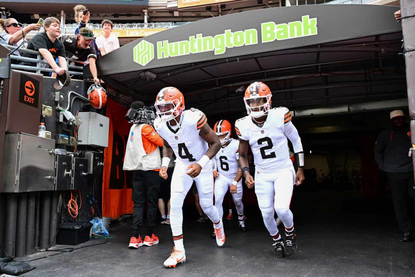 CLEVELAND, OHIO - AUGUST 22: Deshaun Watson #4, Shedeur Sanders #2 and Dillon Gabriel #6 of the Cleveland Browns take the field prior to a preseason game against the Buffalo Bills at Huntington Bank Field on August 22, 2026 in Cleveland, Ohio.