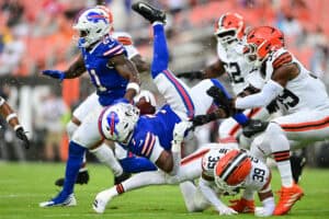 CLEVELAND, OHIO - AUGUST 22: Michael Coats Jr. #39 of the Cleveland Browns tackles Ray Davis #7 of the Buffalo Bills during the first quarter of a preseason game at Huntington Bank Field on August 22, 2026 in Cleveland, Ohio.