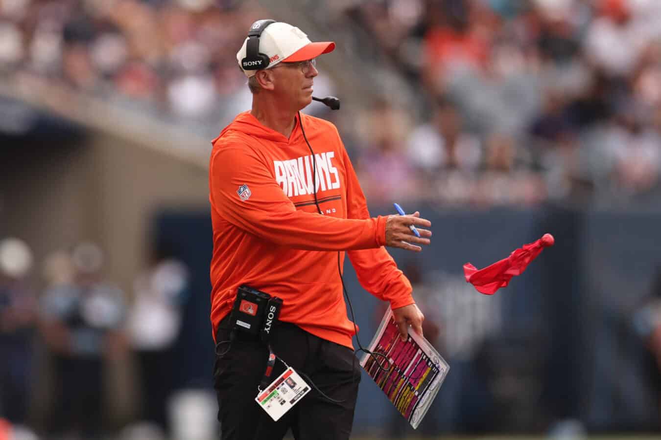 CHICAGO, ILLINOIS - AUGUST 15: Head coach Todd Monken of the Cleveland Browns throws the red flag to challenge a play during the second half of the preseason game against the Chicago Bears at Soldier Field on August 15, 2026 in Chicago, Illinois.