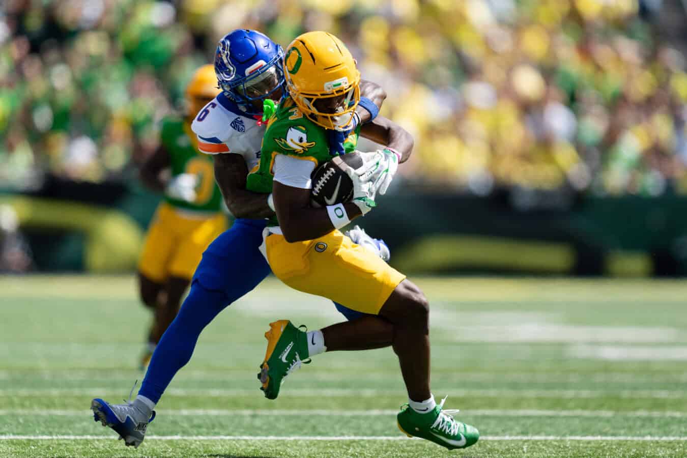 EUGENE, OREGON - SEPTEMBER 5: Wide receiver Jeremiah McClellan #3 of the Oregon Ducks gets tackles by defensive back JeRico Washington Jr. #6 of the Boise State Broncos during the first half of the game at Autzen Stadium on September 5, 2026 in Eugene, Oregon. (
