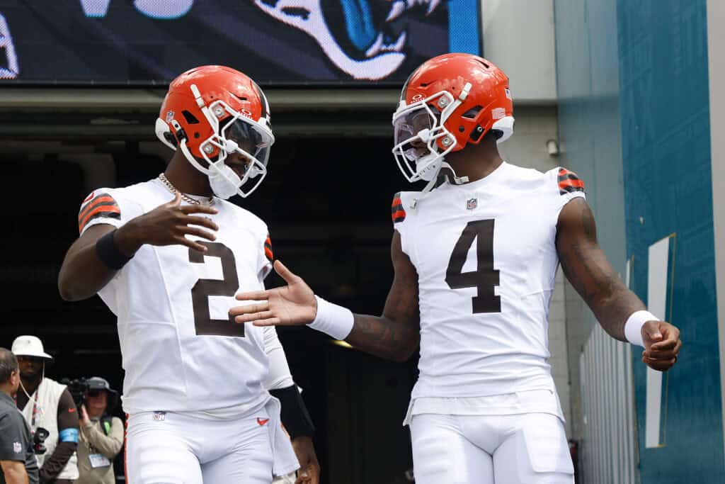 JACKSONVILLE, FLORIDA - SEPTEMBER 13: (L-R) Shedeur Sanders #2 of the Cleveland Browns and Deshaun Watson #4 take the the field for warmups prior to the game against the Jacksonville Jaguars at EverBank Stadium on September 13, 2026 in Jacksonville, Florida.