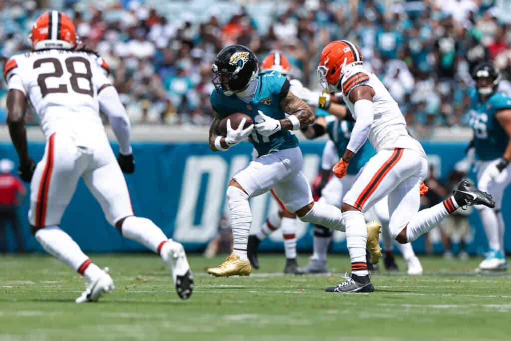 JACKSONVILLE, FLORIDA - SEPTEMBER 13: Parker Washington #11 of the Jacksonville Jaguars runs the ball against the Cleveland Browns during the first half of the game at EverBank Stadium on September 13, 2026 in Jacksonville, Florida.