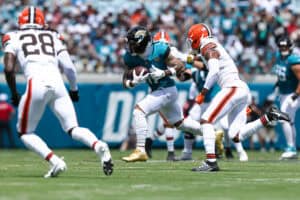 JACKSONVILLE, FLORIDA - SEPTEMBER 13: Parker Washington #11 of the Jacksonville Jaguars runs the ball against the Cleveland Browns during the first half of the game at EverBank Stadium on September 13, 2026 in Jacksonville, Florida.
