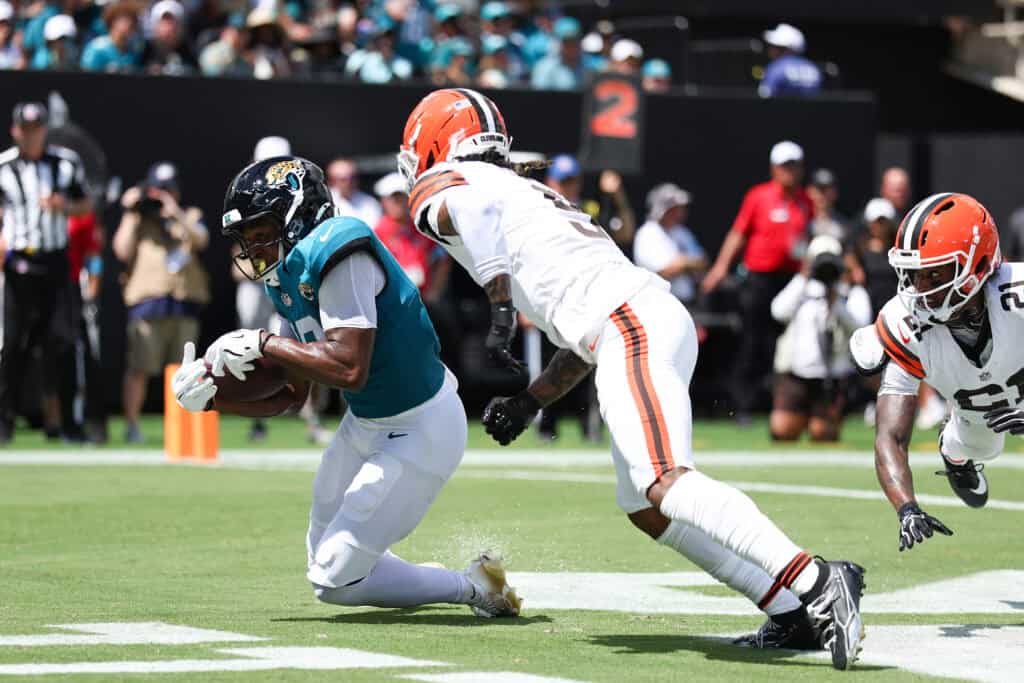 JACKSONVILLE, FLORIDA - SEPTEMBER 13: Josh Cameron #19 of the Jacksonville Jaguars scores a touchdown against the Cleveland Browns during the first quarter of the game at EverBank Stadium on September 13, 2026 in Jacksonville, Florida.