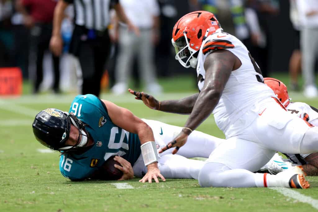 JACKSONVILLE, FLORIDA - SEPTEMBER 13: Mason Graham #94 of the Cleveland Browns sacks Trevor Lawrence #16 of the Jacksonville Jaguars during the third quarter of the game at EverBank Stadium on September 13, 2026 in Jacksonville, Florida.