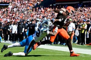 CLEVELAND, OHIO - SEPTEMBER 27: Deshaun Watson #4 of the Cleveland Browns is hit by Lathan Ransom #22 of the Carolina Panthers during the second quarter at Huntington Bank Field on September 27, 2026 in Cleveland, Ohio.