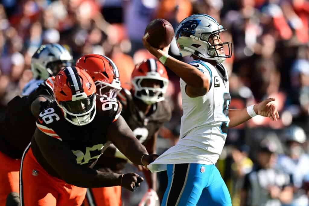 CLEVELAND, OHIO - SEPTEMBER 27: Bryce Young #9 of the Carolina Panthers throws under pressure from Maliek Collins #96 of the Cleveland Browns during the fourth quarter at Huntington Bank Field on September 27, 2026 in Cleveland, Ohio.