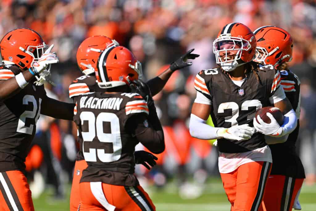 CLEVELAND, OHIO - SEPTEMBER 27: Ronnie Hickman #33 of the Cleveland Browns is congratulated by his teammates after intercepting a pass against the Carolina Panthers during the fourth quarter at Huntington Bank Field on September 27, 2026 in Cleveland, Ohio.