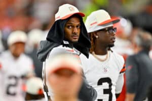 CLEVELAND, OHIO - AUGUST 27: Quarterback Deshaun Watson #4 of the Cleveland Browns watches from the sidelines during the fourth quarter of a preseason game against the New England Patriots at Huntington Bank Field on August 27, 2026 in Cleveland, Ohio. The Browns defeated the Patriots 37-13.