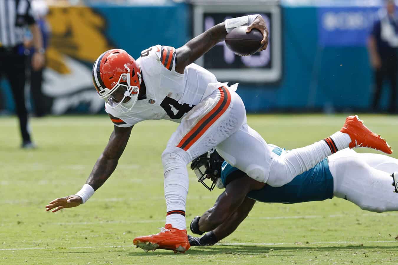 JACKSONVILLE, FLORIDA - SEPTEMBER 13: Deshaun Watson #4 of the Cleveland Browns is tackled by Ventrell Miller #51 of the Jacksonville Jaguars during the second quarter of the game at EverBank Stadium on September 13, 2026 in Jacksonville, Florida