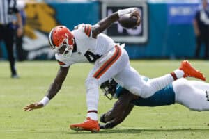 JACKSONVILLE, FLORIDA - SEPTEMBER 13: Deshaun Watson #4 of the Cleveland Browns is tackled by Ventrell Miller #51 of the Jacksonville Jaguars during the second quarter of the game at EverBank Stadium on September 13, 2026 in Jacksonville, Florida