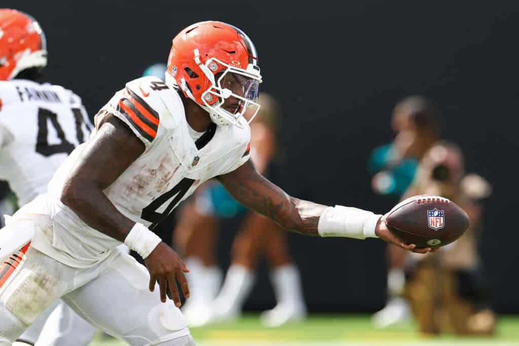 JACKSONVILLE, FLORIDA - SEPTEMBER 13: Deshaun Watson #4 of the Cleveland Browns hands the ball off against the Jacksonville Jaguars during the fourth quarter of the game at EverBank Stadium on September 13, 2026 in Jacksonville, Florida.