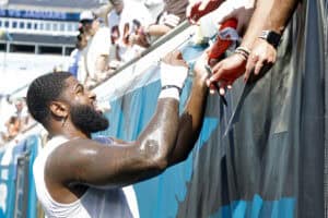 JACKSONVILLE, FLORIDA - SEPTEMBER 13: Jared Verse #8 of the Cleveland Browns signs an autograph prior to the game against the Jacksonville Jaguars at EverBank Stadium on September 13, 2026 in Jacksonville, Florida.