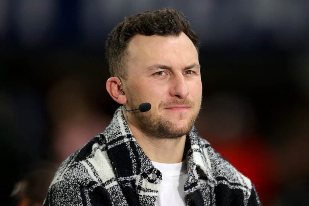ATLANTA, GEORGIA - DECEMBER 03: Football Quarterback Johnny Manziel talks onset prior to the SEC Championship game between the LSU Tigers and the Georgia Bulldogs at Mercedes-Benz Stadium on December 03, 2022 in Atlanta, Georgia.