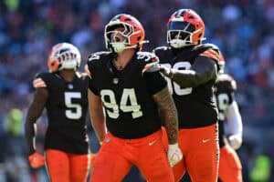 CLEVELAND, OHIO - SEPTEMBER 27: Mason Graham #94 of the Cleveland Browns is congratulated by Maliek Collins #96 after a sack against the Carolina Panthers during the fourth quarter at Huntington Bank Field on September 27, 2026 in Cleveland, Ohio.